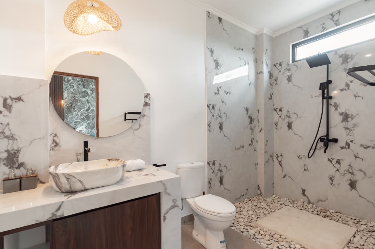 Marble bathroom with rainfall shower at Villa Ikigai